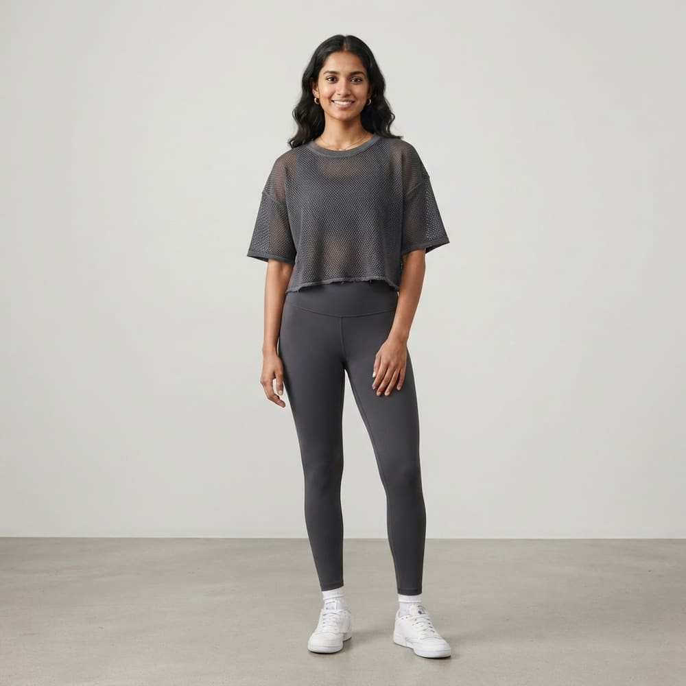 Indian woman wearing META NEST ACTIVEWEAR AirQueen Crop Tee in Storm Charcoal