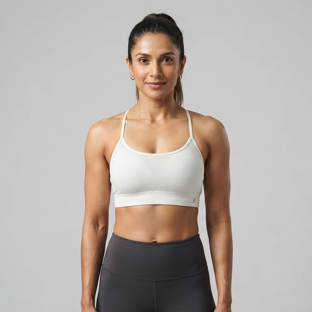 Indian woman wearing META NEST ACTIVEWEAR AirQueen Strappy Bra in Pearl White