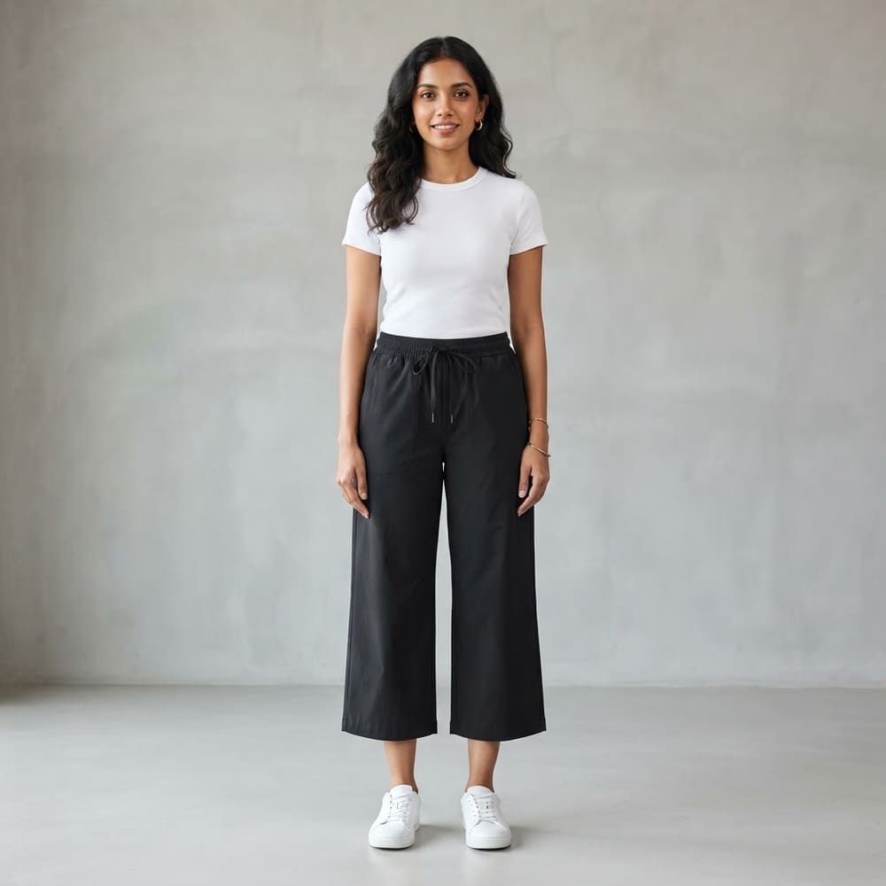 Indian woman wearing META NEST ACTIVEWEAR City Wide-Leg Move Pants in Noir Black