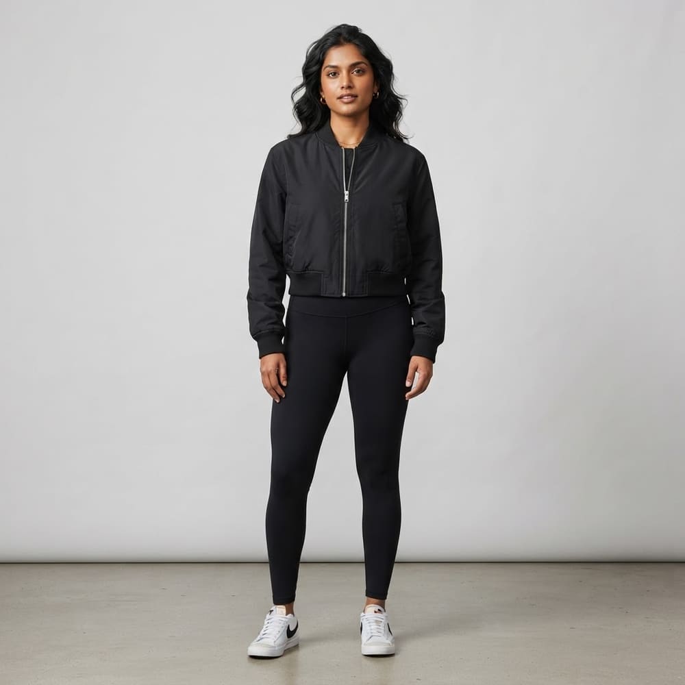 Indian woman wearing META NEST ACTIVEWEAR Cropped Queen Bomber in Noir Black