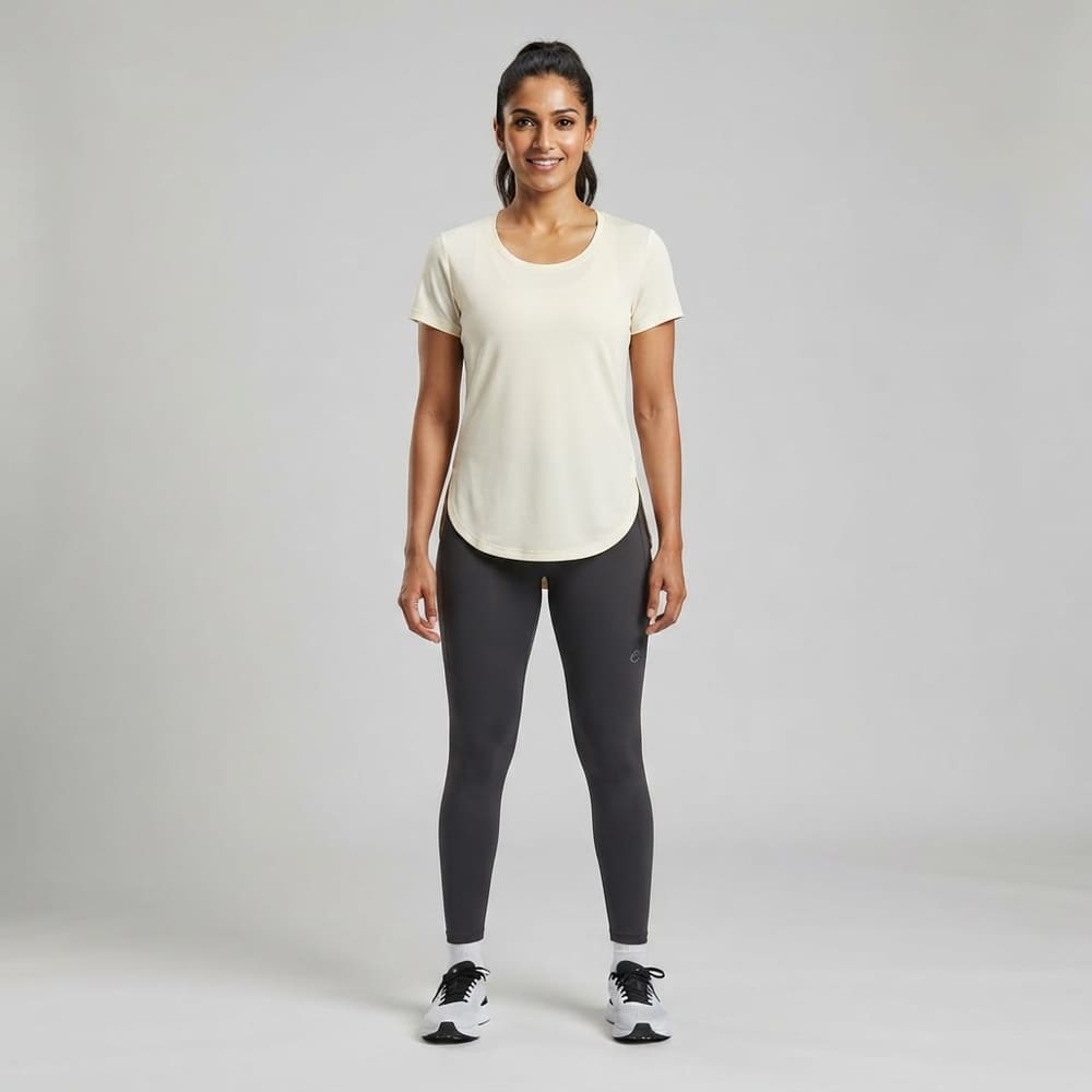 Indian woman wearing META NEST ACTIVEWEAR Curved-Hem Run Tee in Ivory Cream
