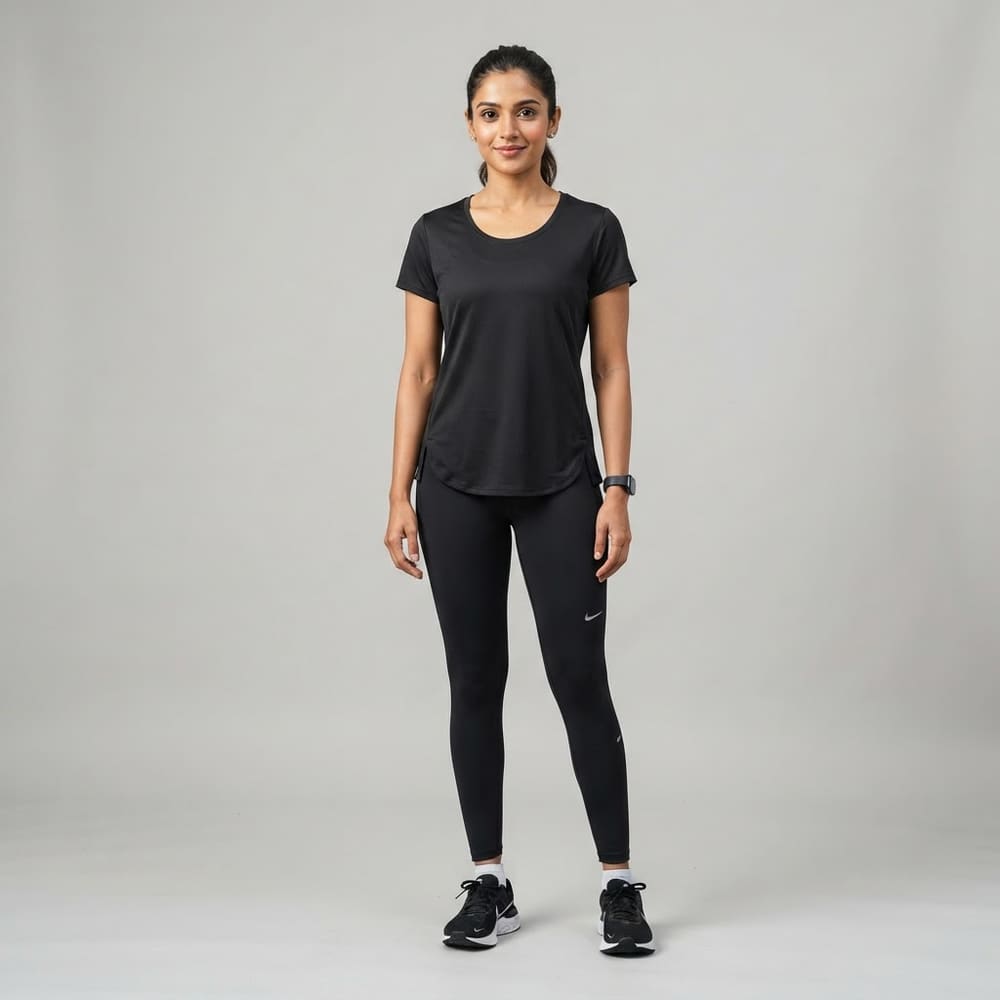 Indian woman wearing META NEST ACTIVEWEAR Curved-Hem Run Tee in Noir Black