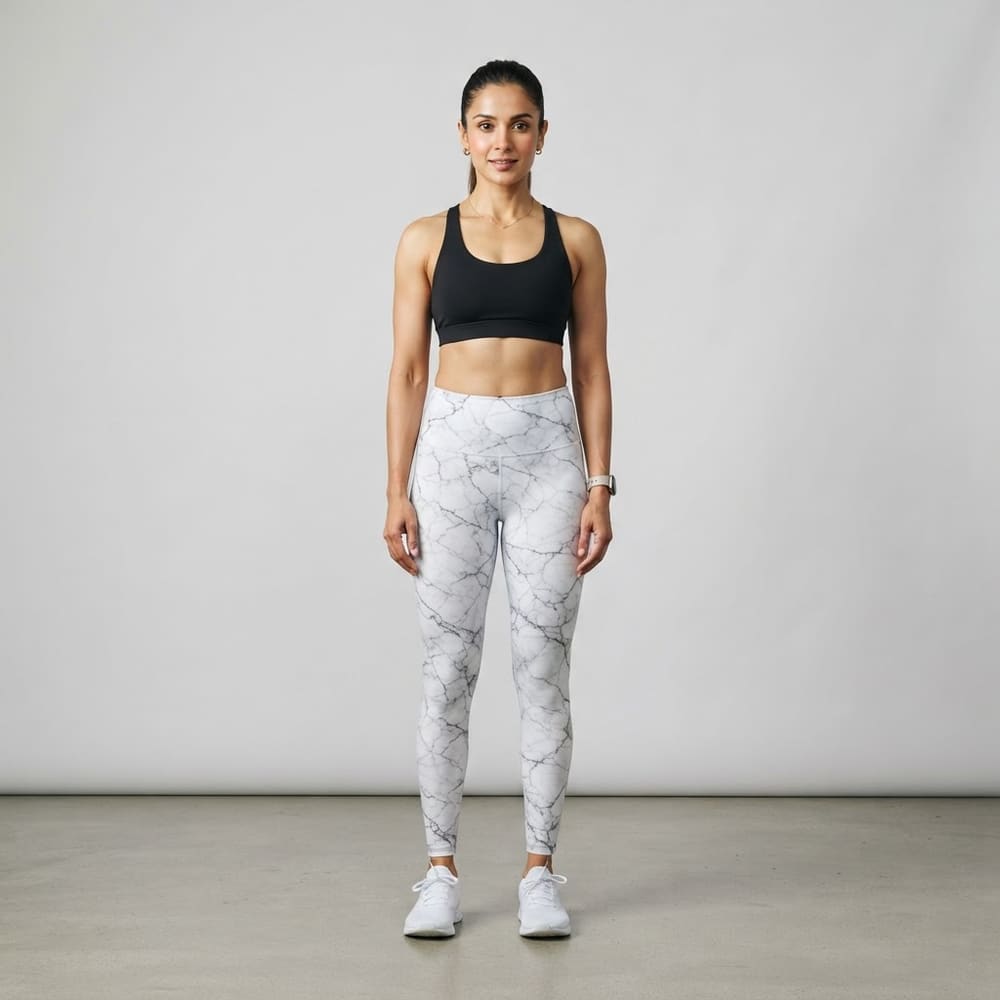 Indian woman wearing META NEST ACTIVEWEAR Marble Print Leggings in Marble White