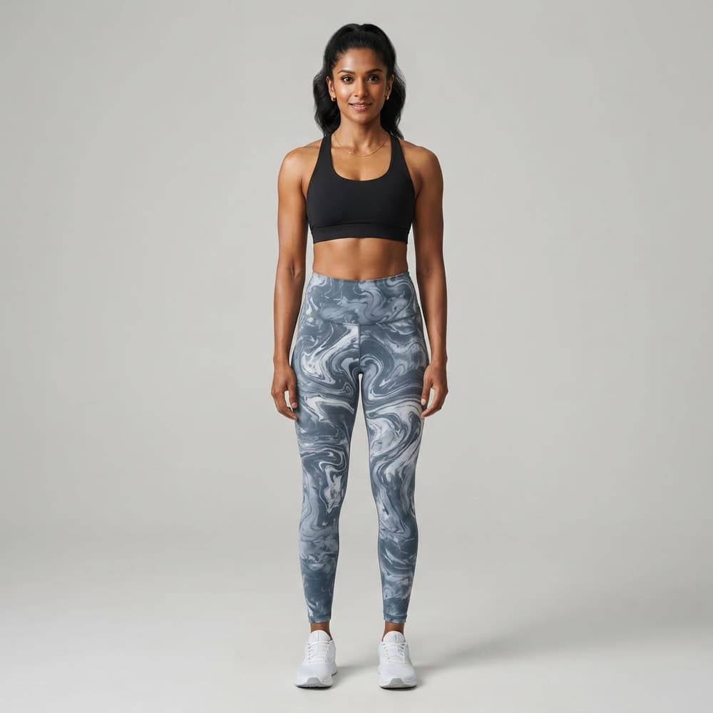 Indian woman wearing META NEST ACTIVEWEAR Marbled Swirl Leggings in Marble Slate