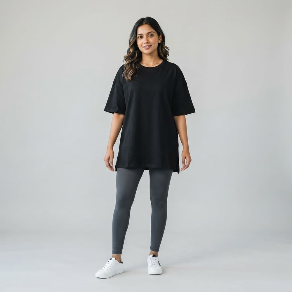 Indian woman wearing META NEST ACTIVEWEAR Oversized Queen Tee in Noir Black
