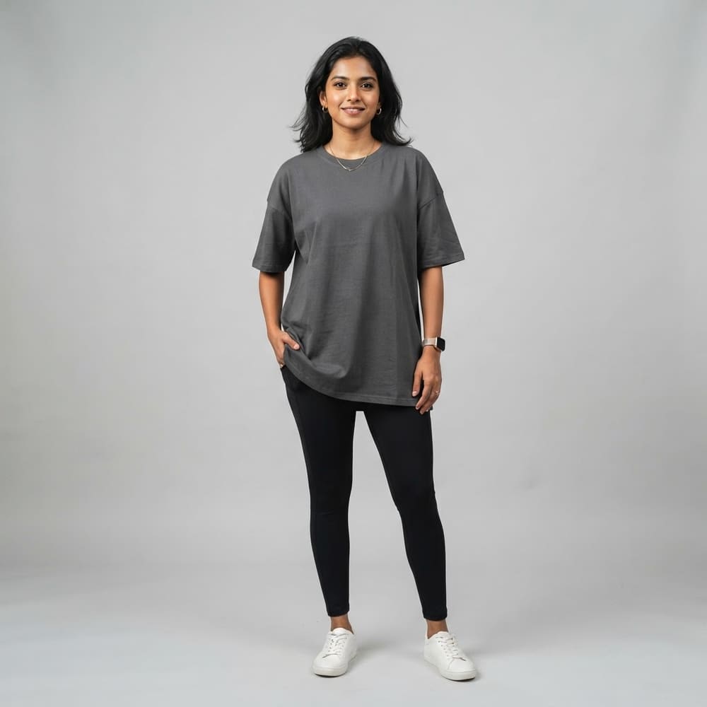 Indian woman wearing META NEST ACTIVEWEAR Oversized Queen Tee in Storm Charcoal