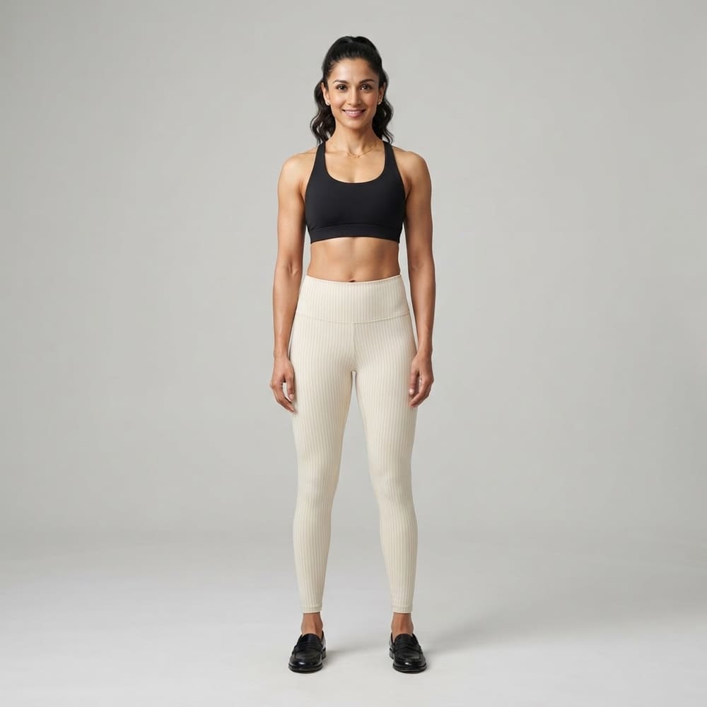 Indian woman wearing META NEST ACTIVEWEAR Pinstripe Leggings in Pinstripe Cream