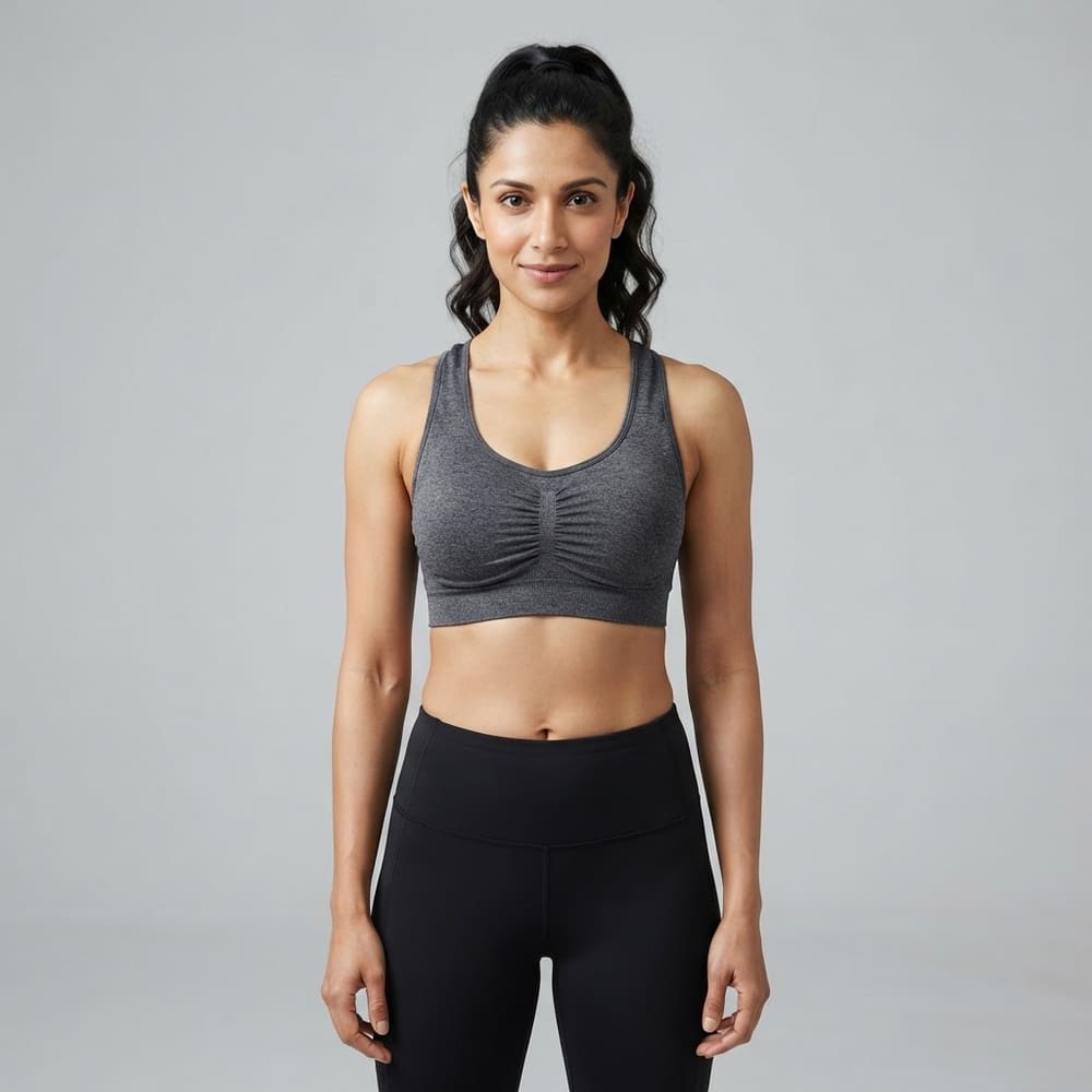 Indian woman wearing META NEST ACTIVEWEAR Ruched Front Scoop Bra in Ruched Charcoal